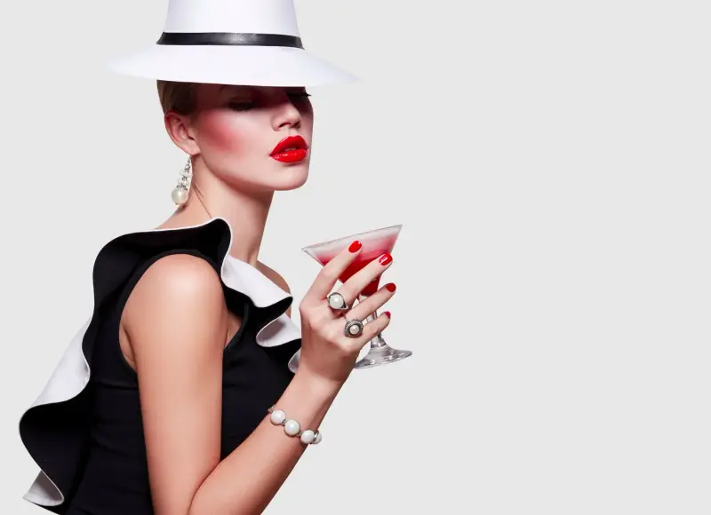 A high-class escort companion enjoying a cocktail in Milan with Top Companions